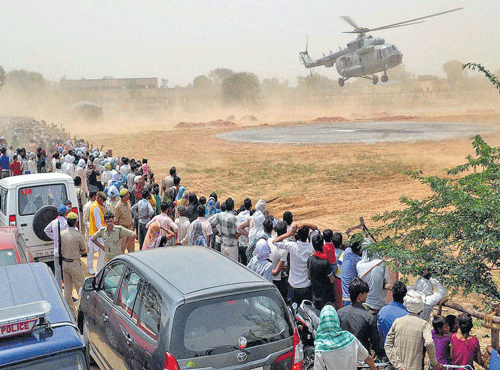 A trial helicopter lands at a rally site in Mathura on Saturday. PTI