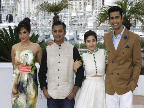 Actress Richa Chadda, director Neeraj Ghaywan, actress Shweya Tripathi and Vicky Kaushal pose for photographers during a photo call for the film Masaan, at the 68th international film festival, Cannes, southern France. AP photo