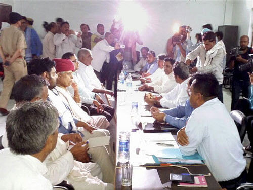 Gujjar leader Kirori Singh Bainsla talks with Rajasthan cabinet ministers at a meeting to demand reservation in government jobs and educational institutions for the community, near Bayana village in Bharatpur district of Rajasthan. PTI photo