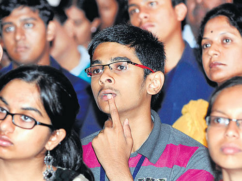 Rapt attention: Students and parents listen to a lecture at the Jnana Degula education fair in Bengaluru on Sunday. DH PHOTOS