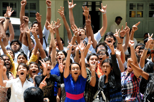 Students celebrating their success after CBSE announced the results. DH file photo