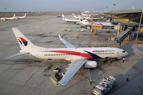 MAS, one of Malaysia's biggest government-linked companies hit by twin tragedies of MH370 and MH17, will terminate the job of its 20,000-employee workforce, and then offer new contracts to two-thirds of them, the Straits Times reported. AP file photo