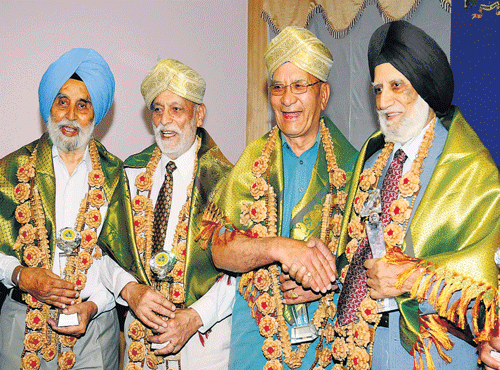 Members of the 1965 expedition to Mt Everest, Nehru institute of Mountaineering former vice principal G S Bhangu, Brigadier (retd) Dr Mulk Raj, SonamWangyal and Captain Manmohan Singh Kohli who were felicitated by the Department of Youth Empowerment and Sports in Bengaluru on Monday. DH PHOTO