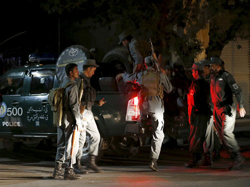 Afghan policemen arrive near the site of an attack in Kabul, Afghanistan. reuters photo