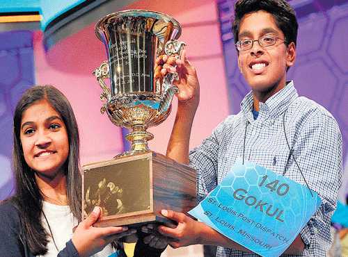Vanya Shivashankar (left) and Gokul Venkatachalam with the trophy. AFP