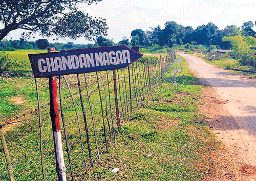 A landmark by the BSF outpost showing direction of  Chandannagar village in Dhalai district of Tripura. Papan Das