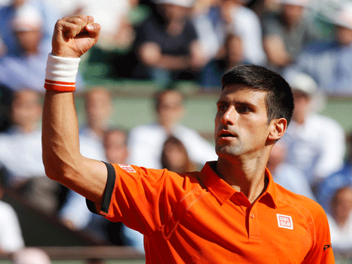 Novak Djokovic of Serbia reacts during his men's quarter-final match against Rafael Nadal of Spain during the French Open tennis tournament at the Roland Garros stadium in Paris, France, June 3, 2015. REUTERS