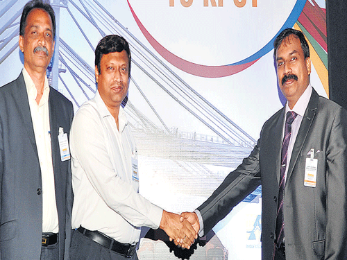 Container Corporation of India Chief Manager S P Shastri (Centre) greets KPCT Executive Director Sriram Ravi Chander (Right) during the launch of the cargo container service to Krishnapatanam Port, in Bengaluru on Thursday. Photo Srikanta Sharma R