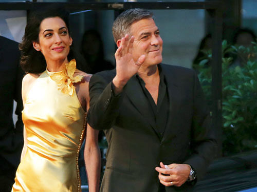 Amal Clooney and  her husband George Clooney. AP File Photo.