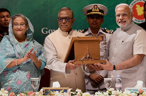 Prime Minister Narendra Modi receives from the President of Bangladesh Mohammed Abdul Hamid the Bangladesh Liberation War Honour on behalf of former Prime Minister Atal Bihari Vajpayee at President House in Dhaka. PTI file photo
