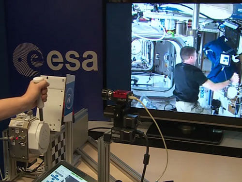 A NASA astronaut aboard the International Space Station (ISS) has been able to 'shake hands' with a scientist 8,046 km away on Earth, making history with the first telerobotic 'handshake' between space and Earth. Image: Screengrab