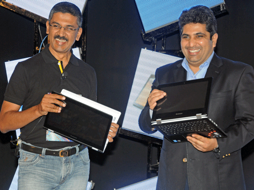 Ashok Nair, National Sales Director, Lenovo India and Anand Dhand, Director MNC Business Sales, Intel South Asia launches new YOGA series laptops at a programme organised by Lenovo (India) private Limited at Taj Vivantha in Bengaluru on Tuesday.  DH Photo