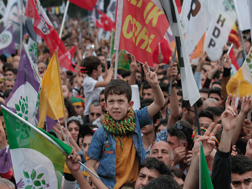 Supporters of the pro-Kurdish Peoples' Democratic Party, (HDP) participate in a rally in Istanbul, Turkey, Monday, June 8, 2015, a day after the elections. The biggest change from Turkey's previous parliament is the ascendancy of the People's Democratic Party, a socially liberal force rooted in the Kurdish nationalism of Turkey's southeast. AP