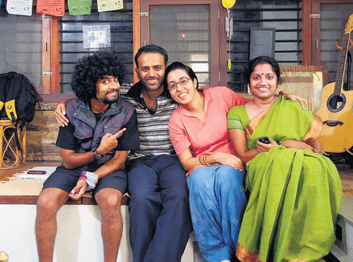 Vasu with his wife (extreme right) and friends at their home.