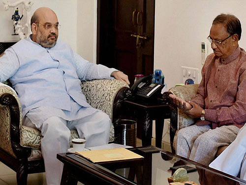 Bharatiya Janata Party (BJP) President, Amit Shah and Former Congress leader Giridhar Gamang during a meeting in New Delhi on Friday.  PTI Photo