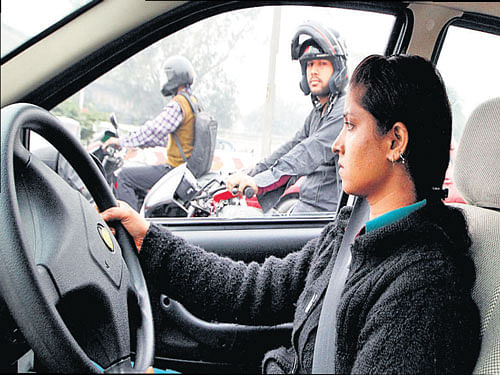 DRIVING AHEAD Savita, a young taxi driver in New Delhi. Photo courtesy: Nicolaus Schmidt