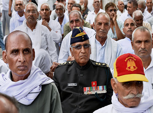Ex-servicemen during their protest over the delay in implementation of 'One Rank, One Pension' (OROP) at Jantar Mantar in New Delhi on Sunday. PTI Photo