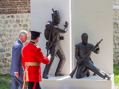 Britain's Prince Charles walks by a newly-unveiled monument during a ceremony for the opening of the Hougoumont farm as part of the bicentennial celebrations for the Battle of Waterloo. Reuters Photo