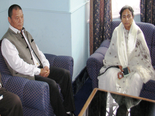 West Bengal CM Mamata Banerjee with Gorkha Janmukti Morcha Chief Bimal Gurung in a meeting in Darjeeling on Wednesday. PTI Photo