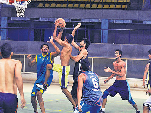 Players compete during the selection trials for Asian Basketball Championship on Thursday. DH photo