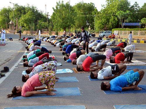 People practicing for World Yoga Day in Jodhpur on Thursday. PTI Photo