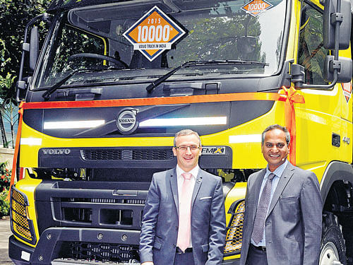 Volvo Group Truck Sales India President Pierre Jean  Verge-Salamon (left) and Senior Vice President Rama Rao A S unveil the company's 10,000th truck in Bengaluru on Thursday. DH Photo by S K Dinesh