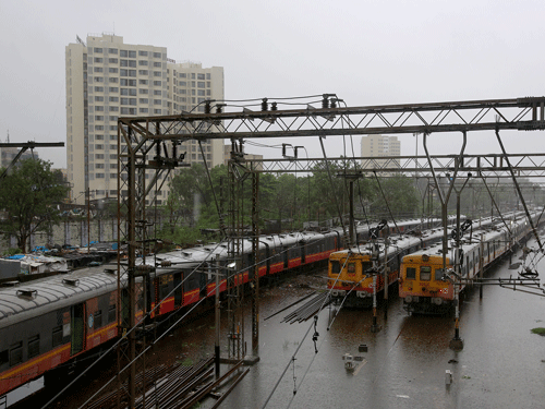 Suburban trains are parked at a station after their services were suspended during heavy rains in Mumbai. Reuters Photo