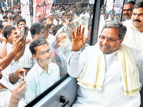 camera-FRIENDLY: Chief Minister Siddaramaiah, who was on rounds to inaugurate various projects in the City, waves at people on Friday. KPN