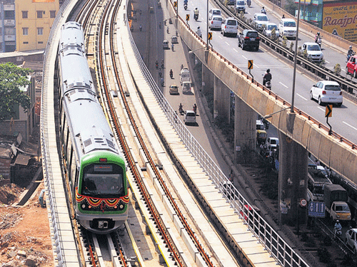 At present, 40 per cent of commuters use cards and  60 per cent use tokens. DH file photo