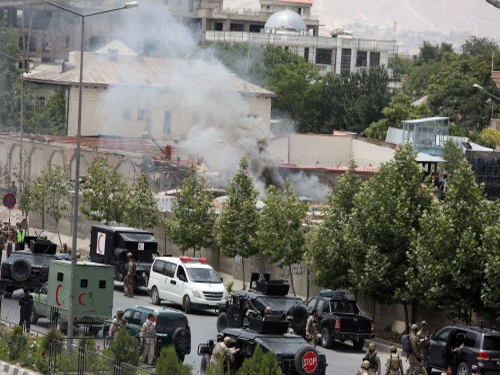 Smoke rises at the site of a suicide attack during clashes with Taliban fighters in front of the Parliament, in Kabul, Afghanistan, Monday. AP photo