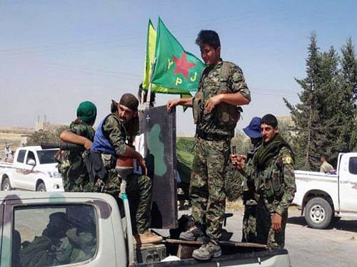 Kurdish fighters. AP Photo.