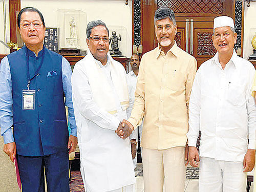 Chief Minister Siddaramaiah greets his Andhra Pradesh counterpart N Chandrababu Naidu  at a meeting of the sub-group of chief ministers on Swachch Bharat Mission constituted  under the NITI Aayog in Bengaluru on Wednesday. (From left) Mizoram Chief Minister Lal Thanhawla, Uttarakhand Chief Minister Harish Rawat, Haryana Agriculture and Irrigation Minister O P Dhankar and Maharashtra Home Minister Ranjit Patil are also seen. dh Photo