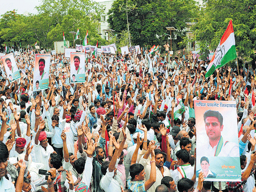 Congress workers during a protest against Rajasthan Chief Minister Vasundhara Raje and Union Minister Sushma Swaraj over Lalit Modi controversy in Jaipur on Wednesday. PTI
