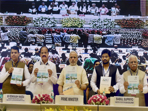 Prime Minister Narendra Modi with Union Urban Development Minister Venkaiah Naidu, MoS Babul Supriyo, Mahrashtra CM Devendra Fadnavis, and Haryana CM M L Khattar releasing the Mission statement & Guidelines of Smart Cities Mission, Atal Mission for Rejuvenation and Urban Transformation (AMRUT) and Housing for All Missions in New Delhi on Thursday. PTI Photo