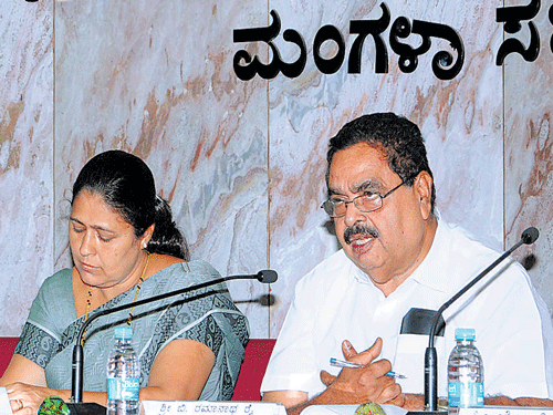 District In-charge Minister B Ramanath Rai chairs a review meeting of the development works undertaken by MCC at Mangaluru City Corporation on Friday. DH photo