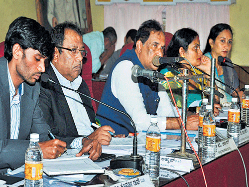 District in-Charge Minister K J George chairs KDP review meeting in Madikeri on Friday. DH photo
