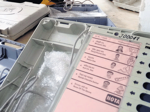 An EVM that carries photos of candidates along with party symbols in Tripura. The modified machines are being used for the first time in the country to check confusion among voters about candidates, especially in constituencies where namesakes are contesting. PHOTO: PAPAN DAS
