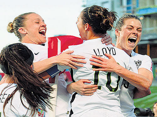 ECSTATIC Carli Lloyd (10) of the United States celebrates her goal with teammates during the quarterfinals of the Women's World Cup in Ottawa on Friday. AP