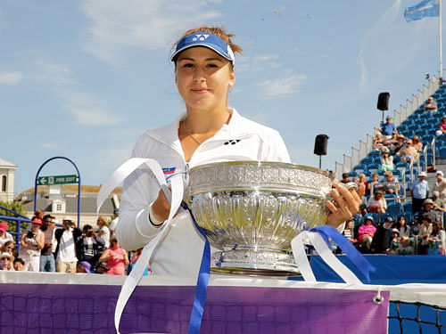 Switzerland's Belinda Bencic celebrates with the trophy after winning the final Action Images via Reuters.