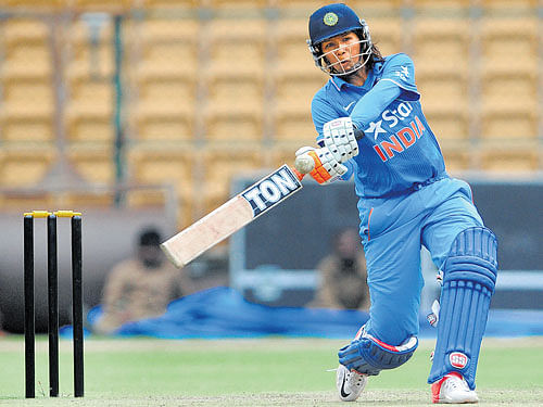 CRUCIAL KNOCK: India's Jhulan Goswami en route to her half-century in the first ODI at the Chinnaswamy Stadium in Bengaluru on Sunday. DH PHOTO/ RANJU P