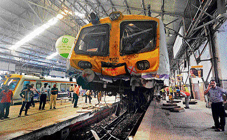 A local train hit the buffer end of the Churchgate station in Mumbai and nearly mounted on the  platform on Sunday. DH Photo