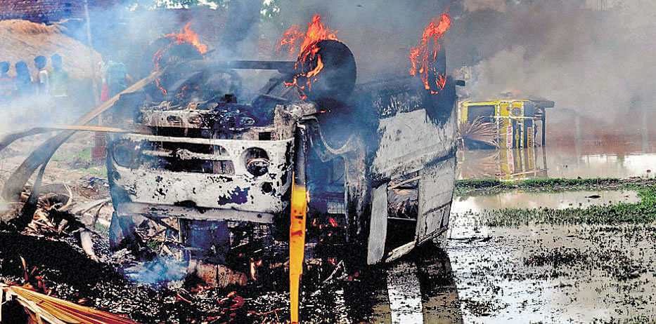 Two school vans were torched by angry locals following  recovery of bodies of two students of a residential school near Nirpur village in Bihar's Nalanda district on Sunday. PTI