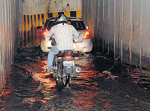 CLOGGED When it rains, it's a struggle tomove through the underpass near Windsor Manor Junction. DH