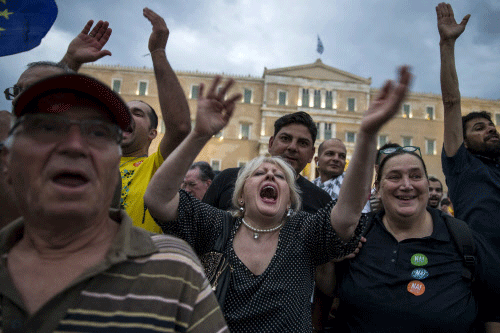 Pro-Euro protesters shout slogans during a rally in front of the parliament building in Athens, Greece, June 30, 2015. Greece's conservative opposition warned on Tuesday that Sunday's vote over international bailout terms would be a referendum over the country's future in Europe, and that wages and pensions would be threatened if people were to reject the package. REUTERS