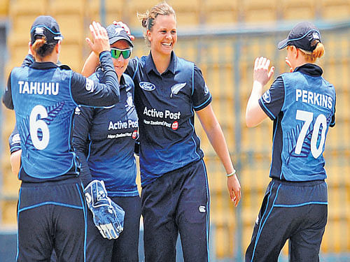 hitting back New Zealand skipper Suzie Bates (2nd from right) celebrates with team-mates after dismissing an Indian batter on Wednesday. DH photo/ kishor kumar bolar