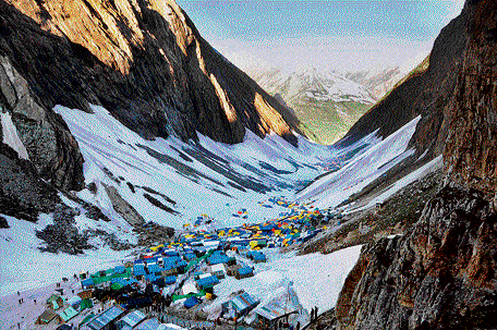 A view of the snow-covered valley near the holy cave shrine of Amarnath on Thursday.  PTI