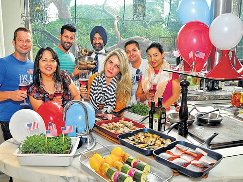Festive Spirit:(Back row) Petter, Anand, Chef Jolly, Eddie and Viviana. (Front row) Ema and Vera Leite. DH photo by BK Janardhan. Location courtesy: JW Marriott