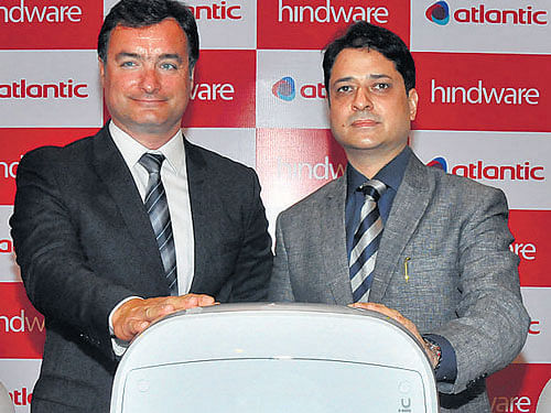 Rajeev Kaul (right) and Serge Raveyre unveil the line of  hindware-atlantic geysers in Bengaluru on Friday. DH&#8200;Photo
