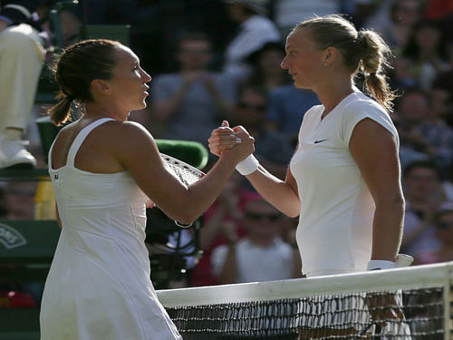 elena Jankovic of Serbia, left, shakes hands after defeating Petra Kvitova of the Czech Republic in their singles match at the All England Lawn Tennis Championships in Wimbledon, London, Saturday July 4, 2015.  AP Photo.