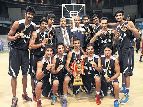 Champions:&#8200;The Indian basketball team with the South&#8200;Asian Basketball title at the Sree Kanteerava Stadium in Bengaluru on Sunday. From Left (standing): Akashdeep Hazra, Prasanna Venkatesh, Arvind A, Goutam Ganguly (manager), GLR Prasad (coach), Rikin Pethani, Annadurai Aravind, Pratham Singh, Gurvinder Singh Gill; Kneeling: Narender Grewal , Vikas Kumar, Vinay Kaushik, Joginder Singh, Pari Akhilan. DH Photo/ Kishor Kumar Bolar